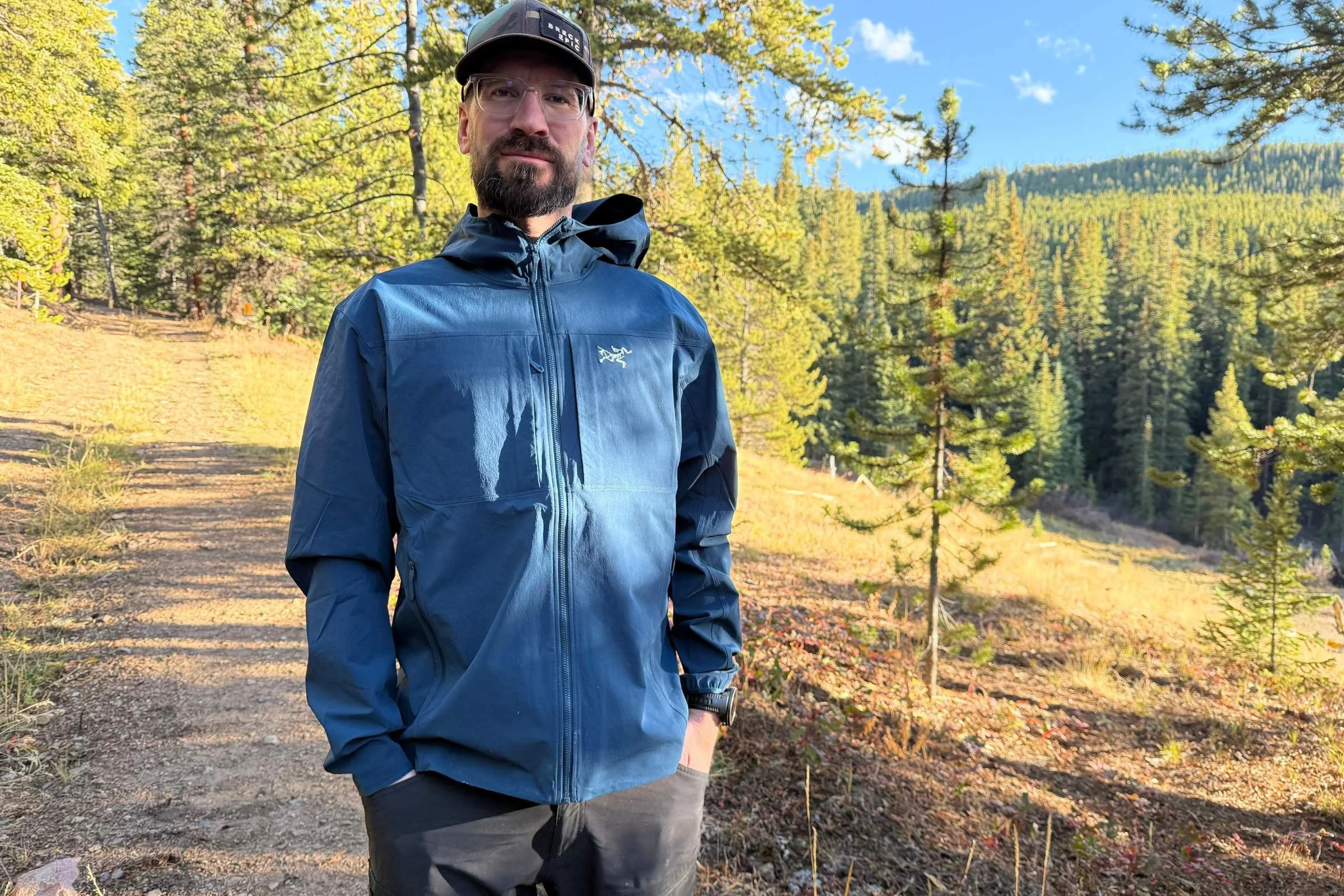 Testing an Arc'teryx Gamma hoody on a rocky mountain ridge during autumn.