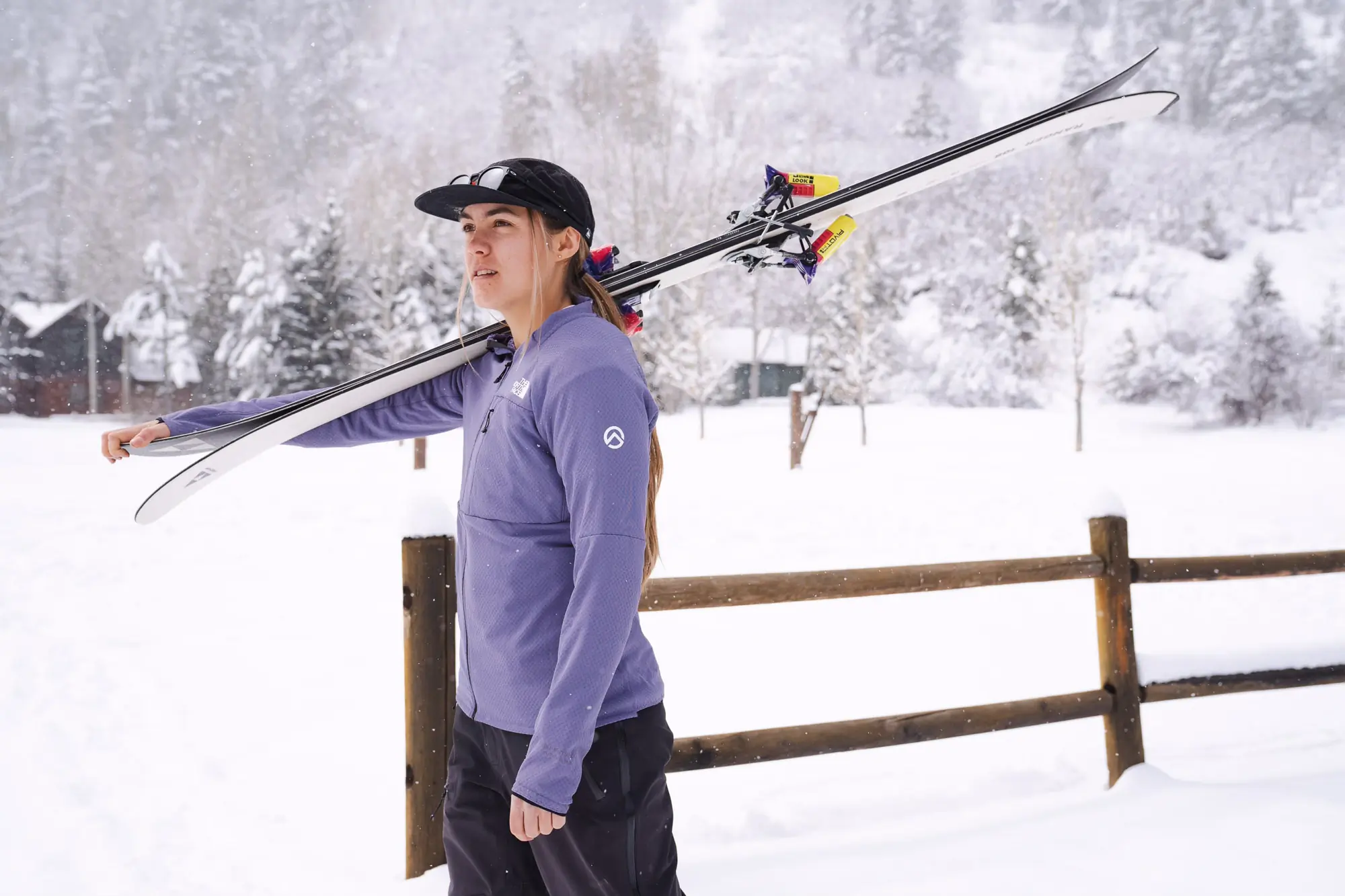 Outdoor gear testers evaluating various insulation layers in a mountain setting.