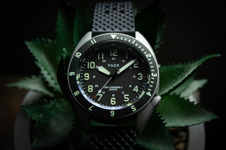 Extreme close-up of a Vaer watch dial showing the lume application and hands.