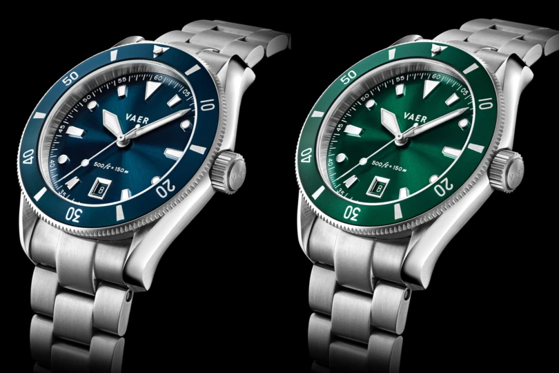 Collection of Vaer DS2 Meridian dive watches in navy, black, and green colorways.