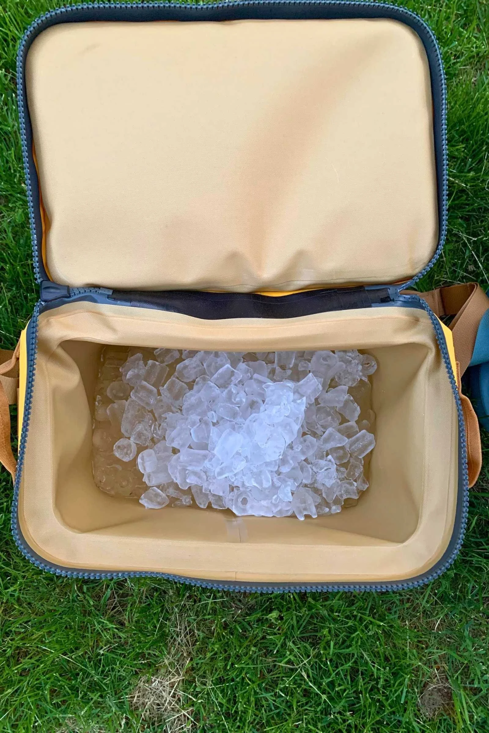 A top-down view of an open Yeti Hopper Flip 12 showing ice levels during a retention test.