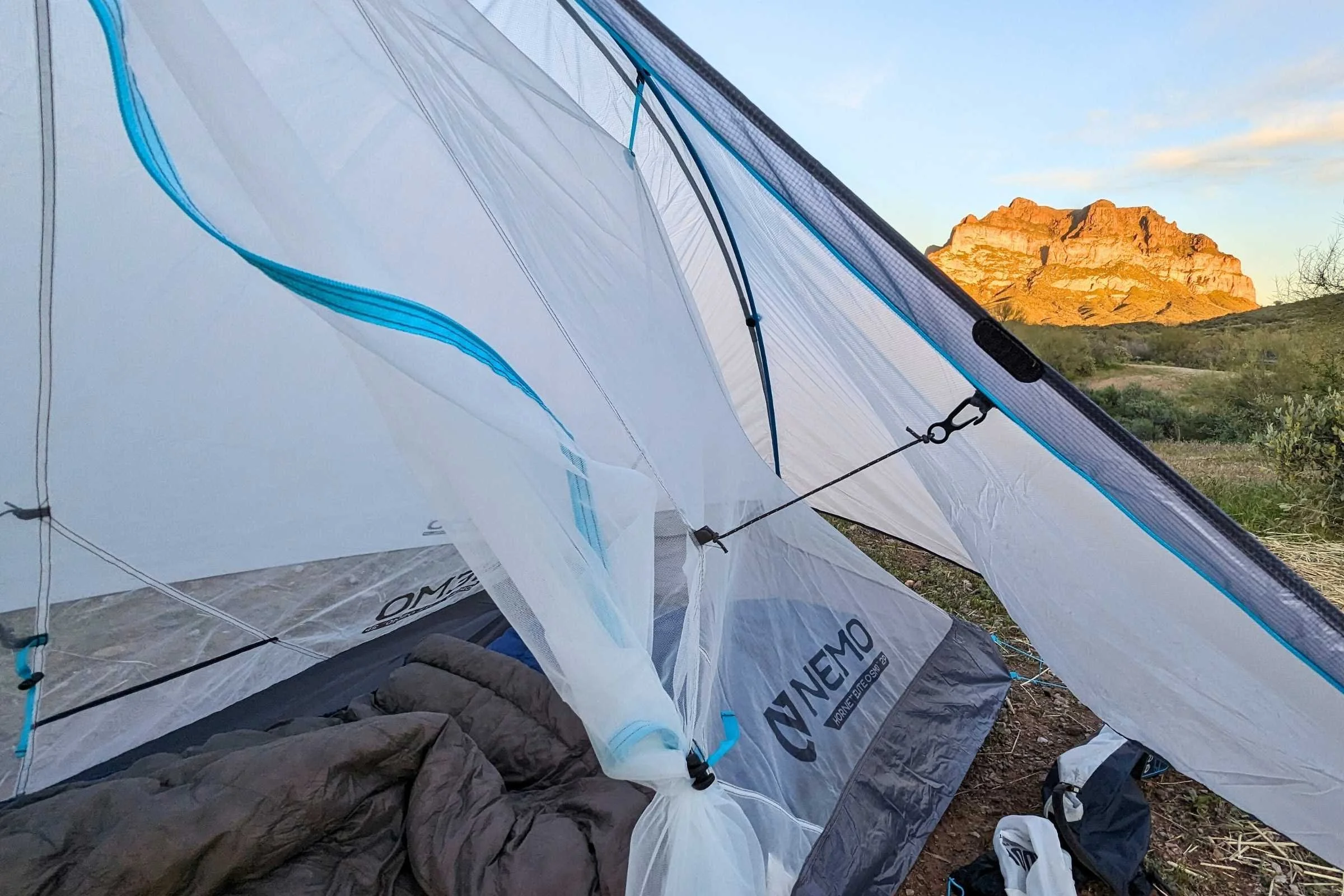 A Nemo Hornet Elite Osmo tent pitched on rocky ground showing its Y-shaped pole structure.