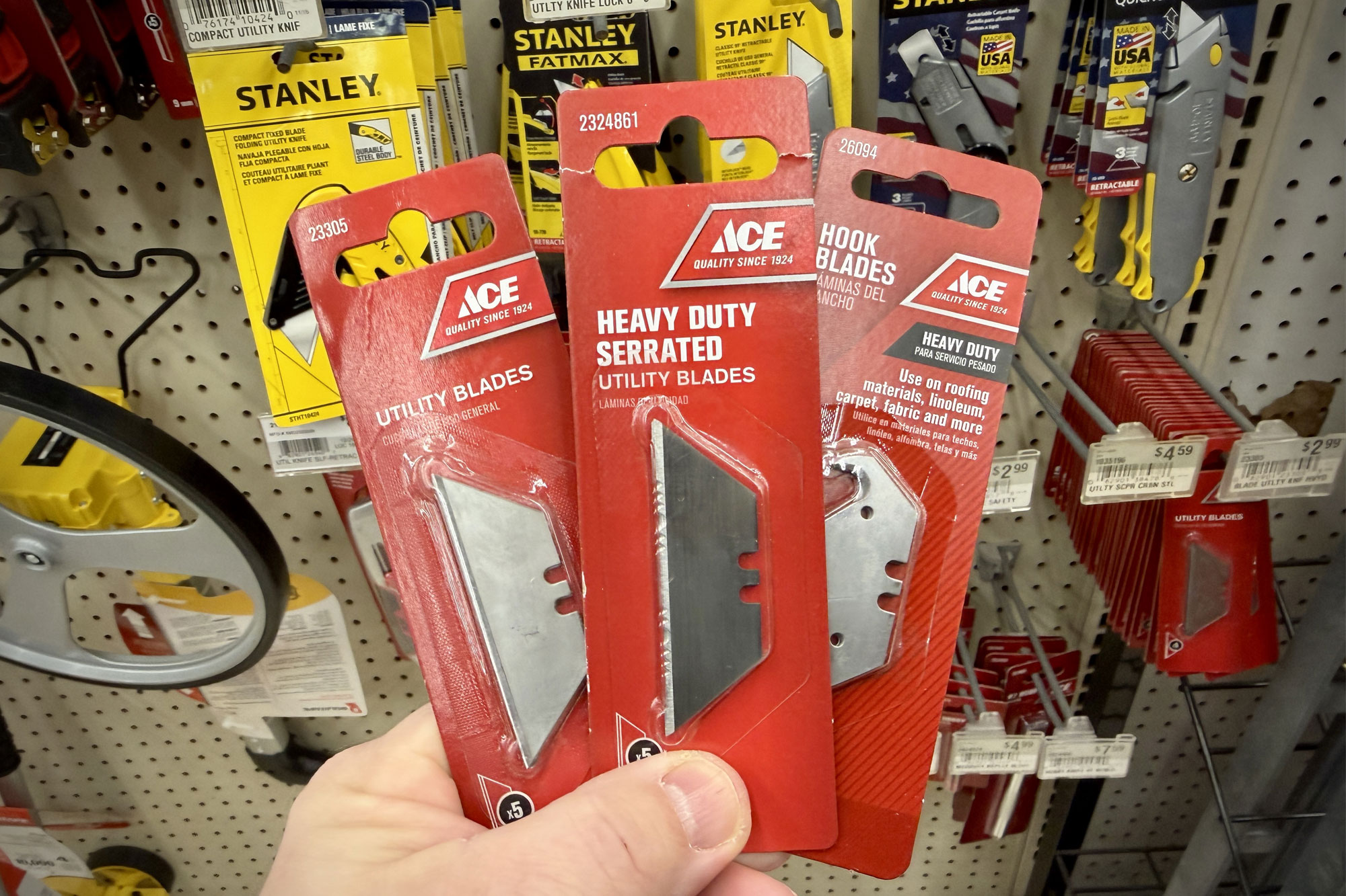 An array of four Knafs Yuti knives featuring different handle scale colors and patterns.