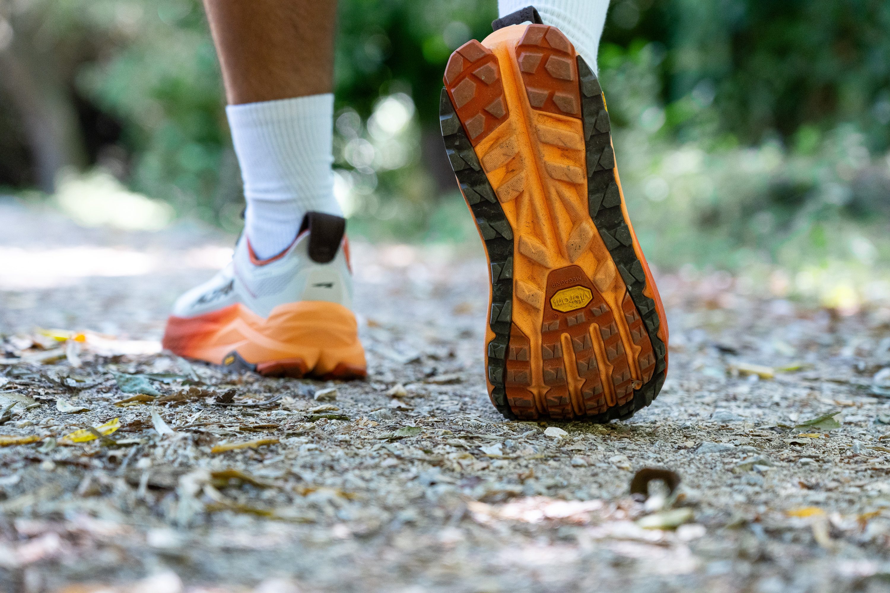 Close-up of the Vibram Megagrip outsole on the Altra Olympus 6 showing lug patterns.