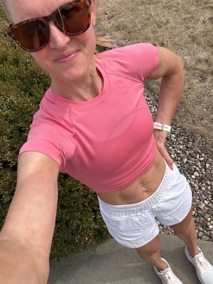 A runner wearing the lululemon Track That 5-inch high-rise shorts.