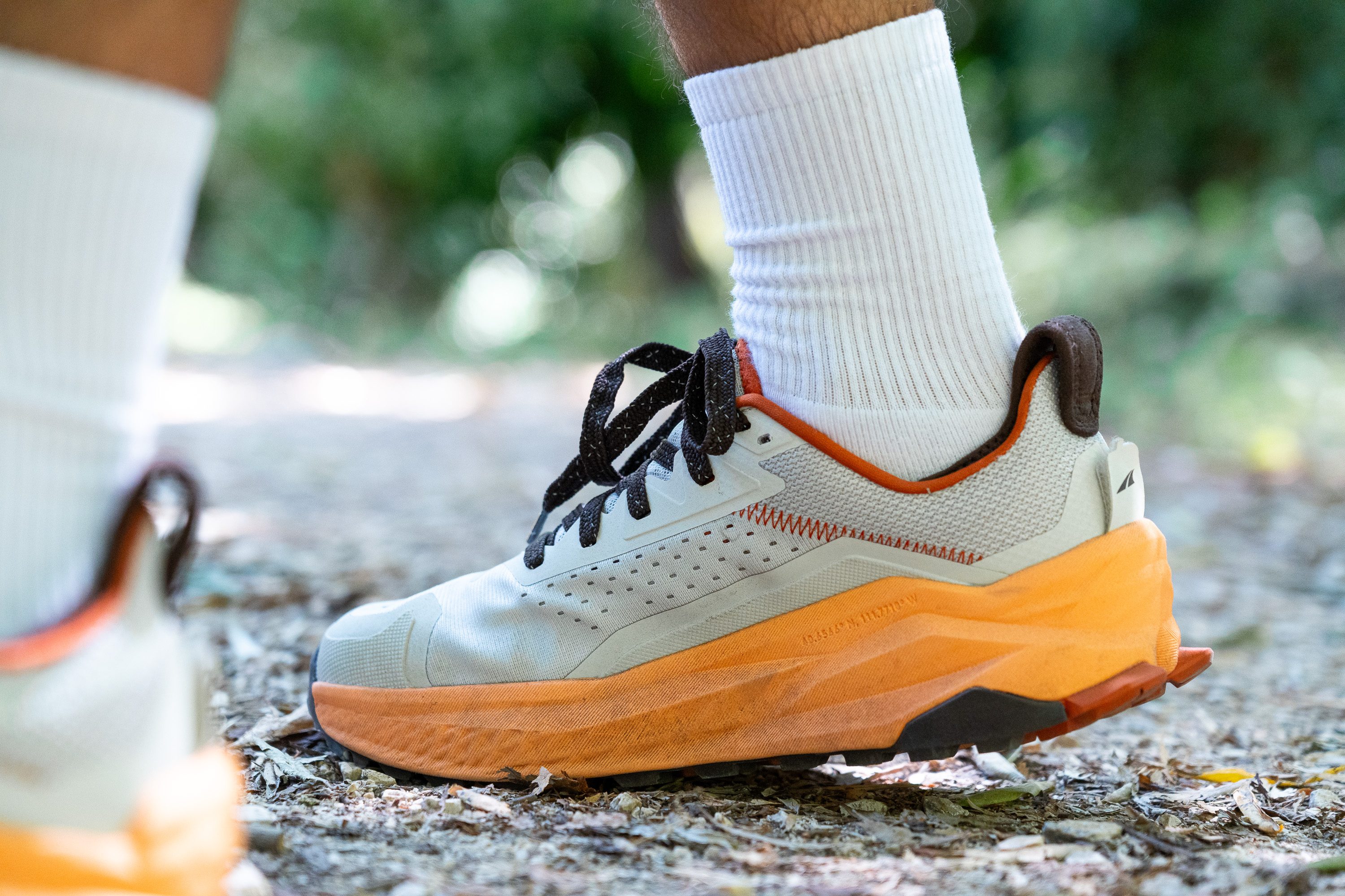 Lateral side view of the Altra Olympus 6 highlighting its maximalist foam cushioning.