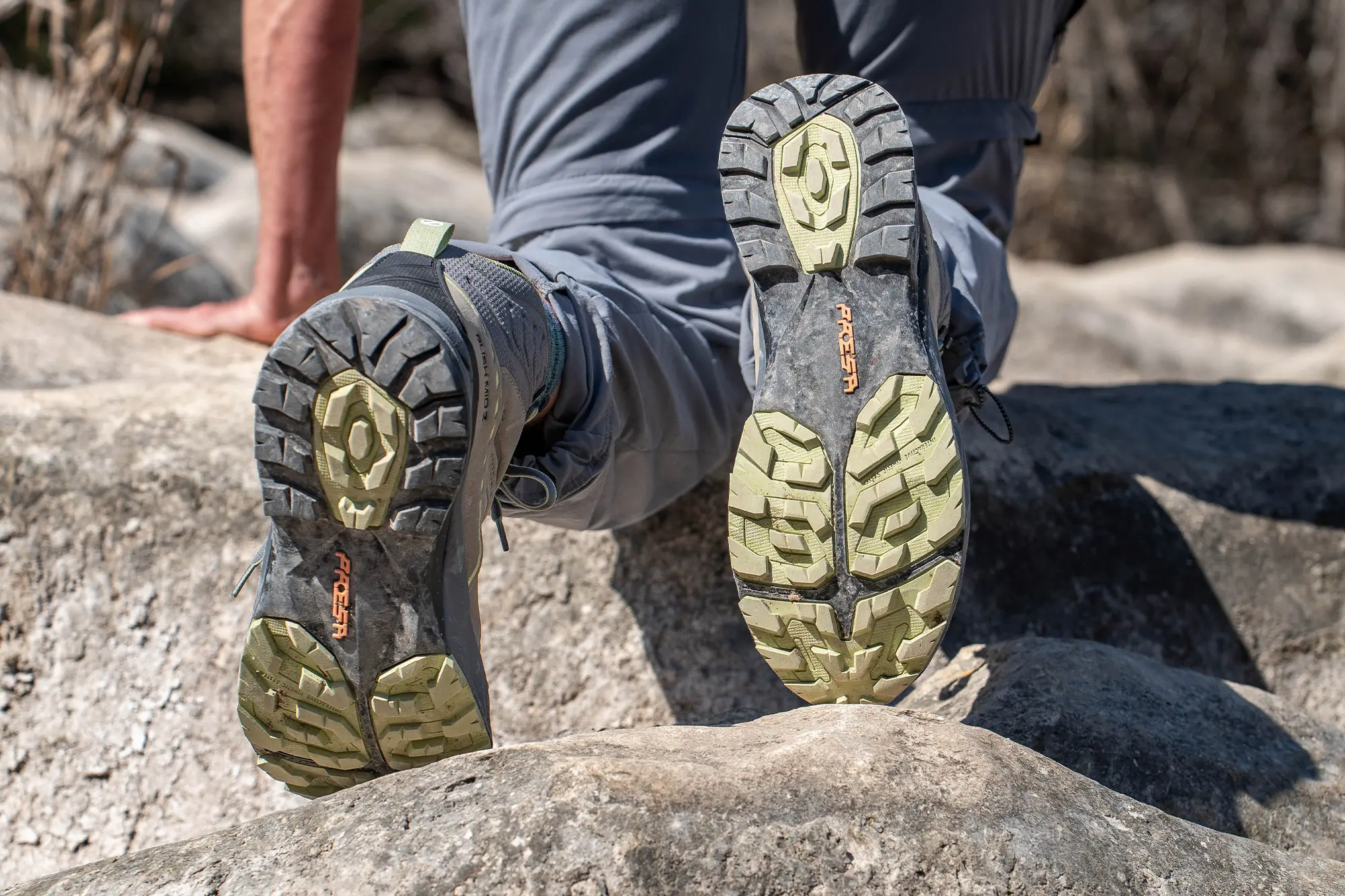 Close-up of the rubber outsole of a hiking boot showing the lug pattern.