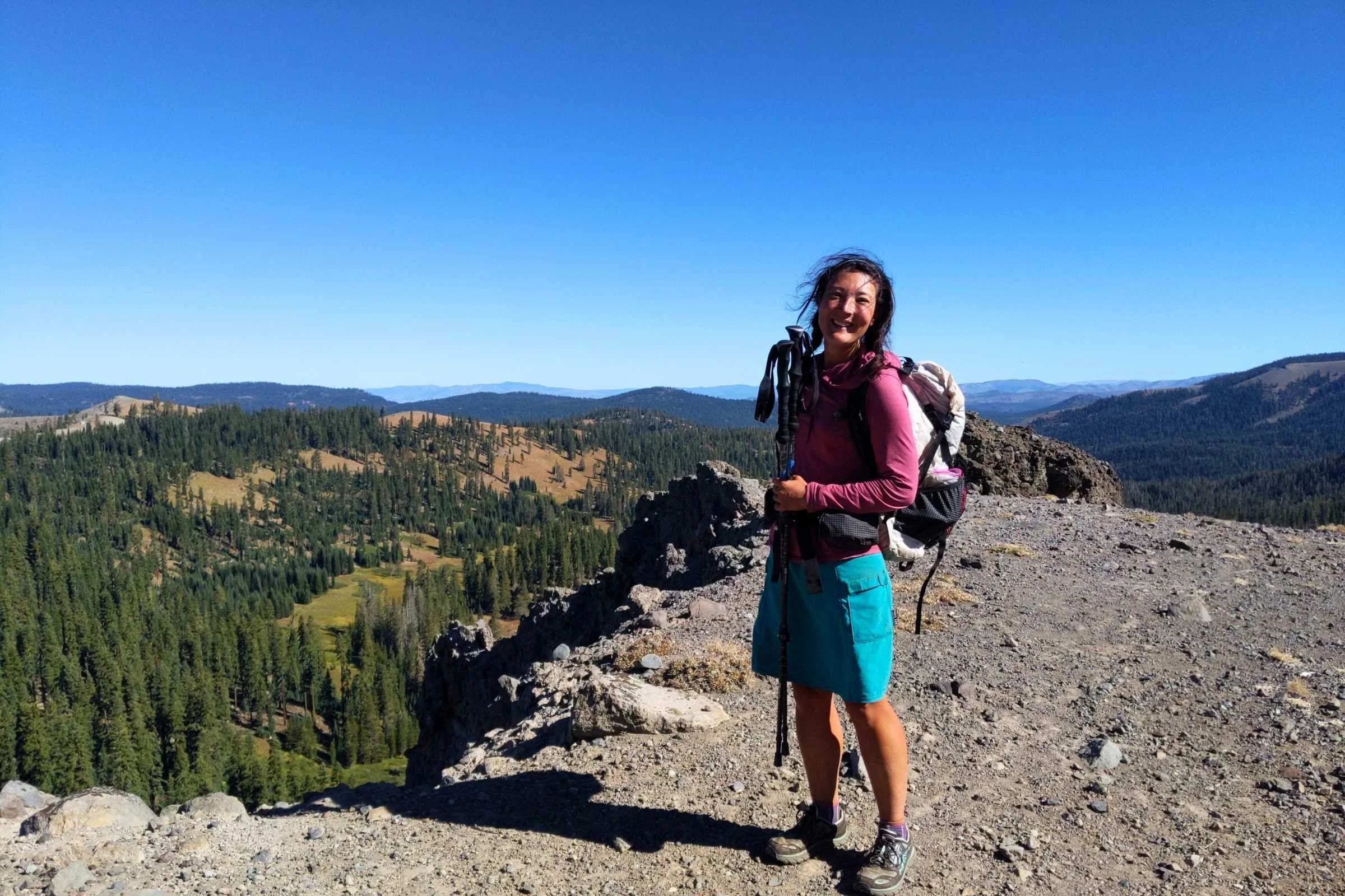 A set of Cascade Mountain Tech trekking poles being used on a dusty section of the Pacific Crest Trail.