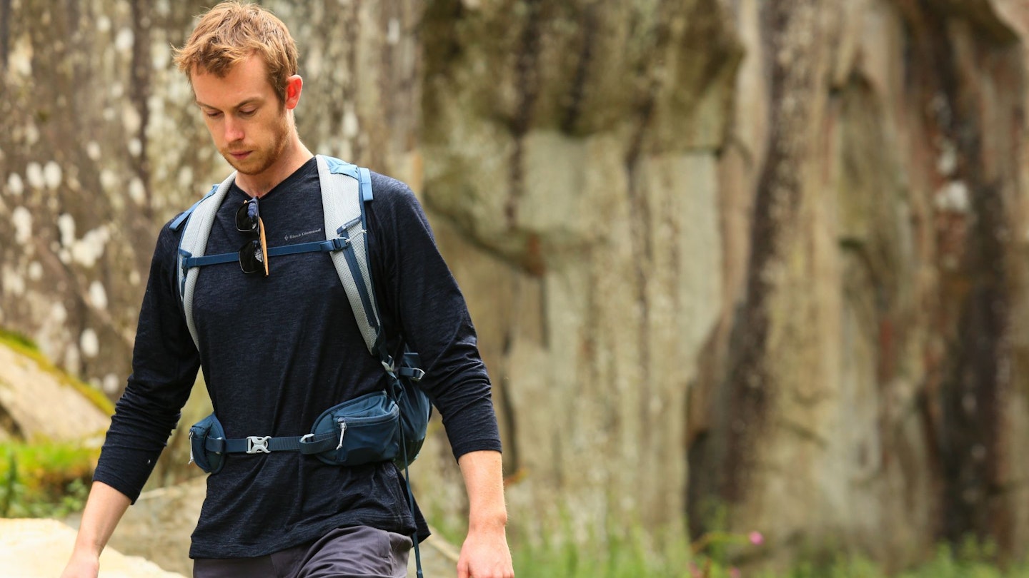 Close up of a hiker wearing a fine-knit merino wool base layer.