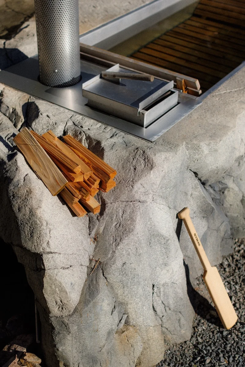 A close-up detail of the aluminum interior and the sculpted edge of the hot tub.