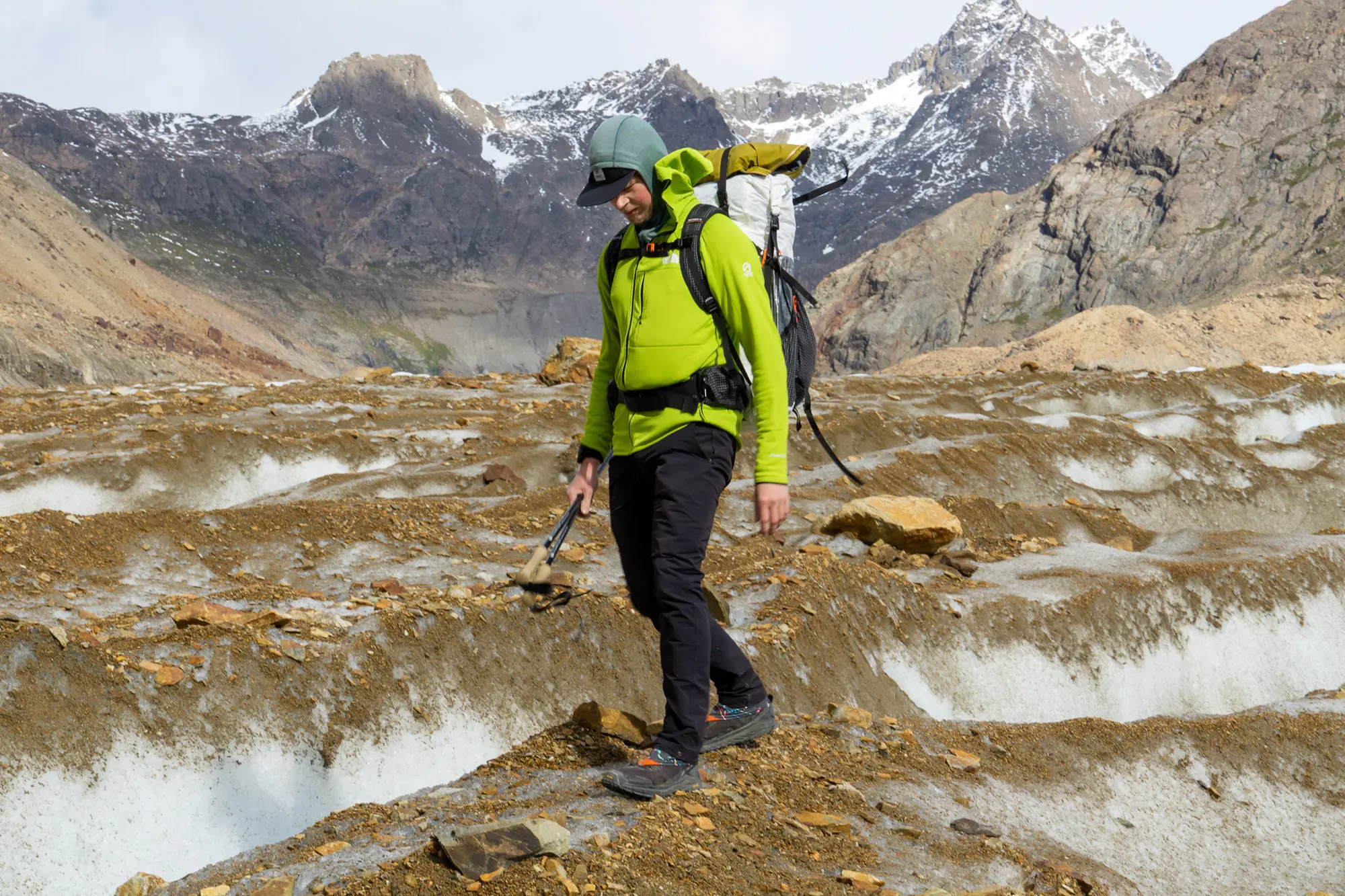 Close-up of technical midlayer fabric showing texture and zipper details.