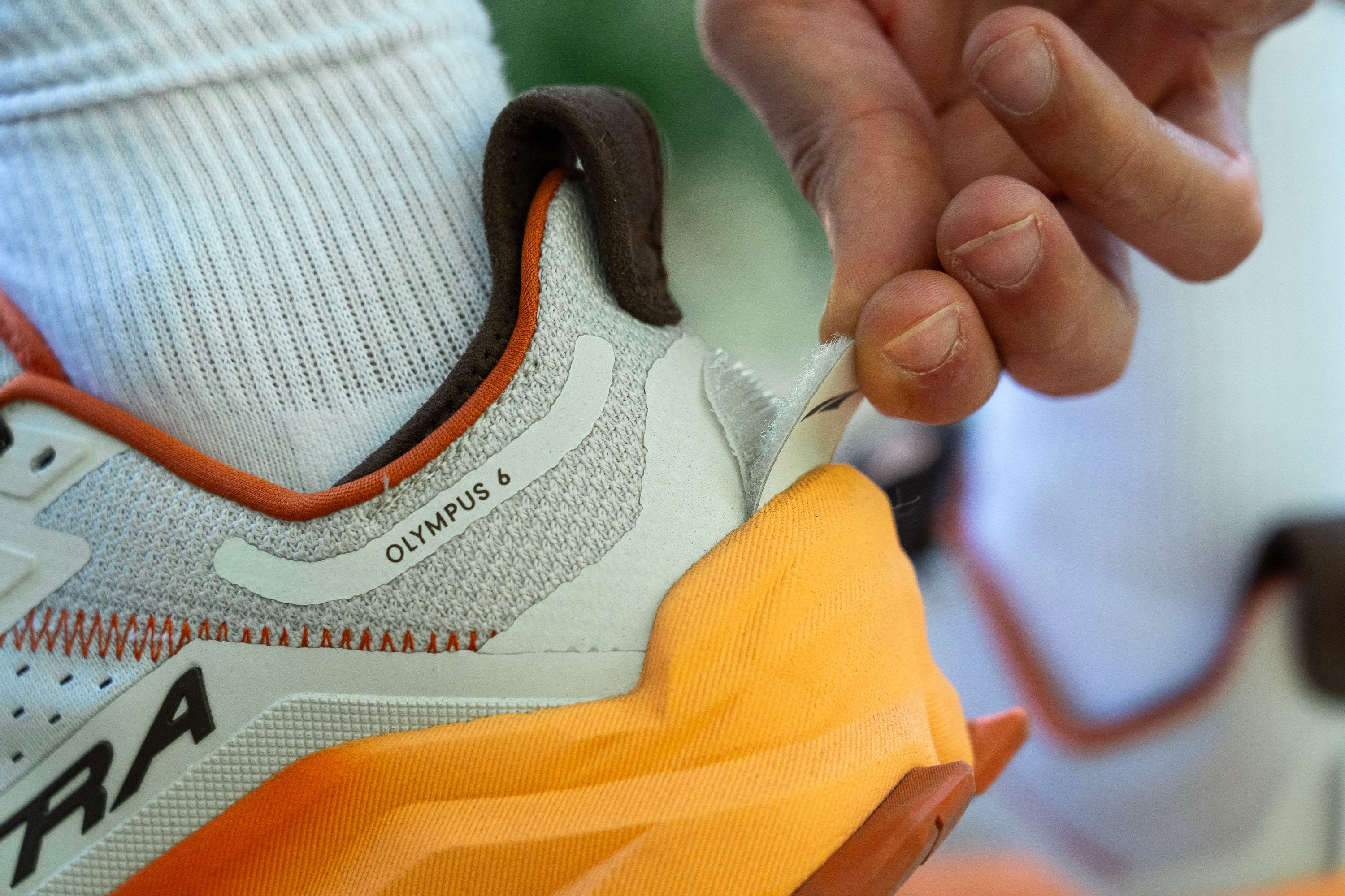 Close-up of the heel of the Altra Olympus 6 showing the GaiterTrap attachment point.