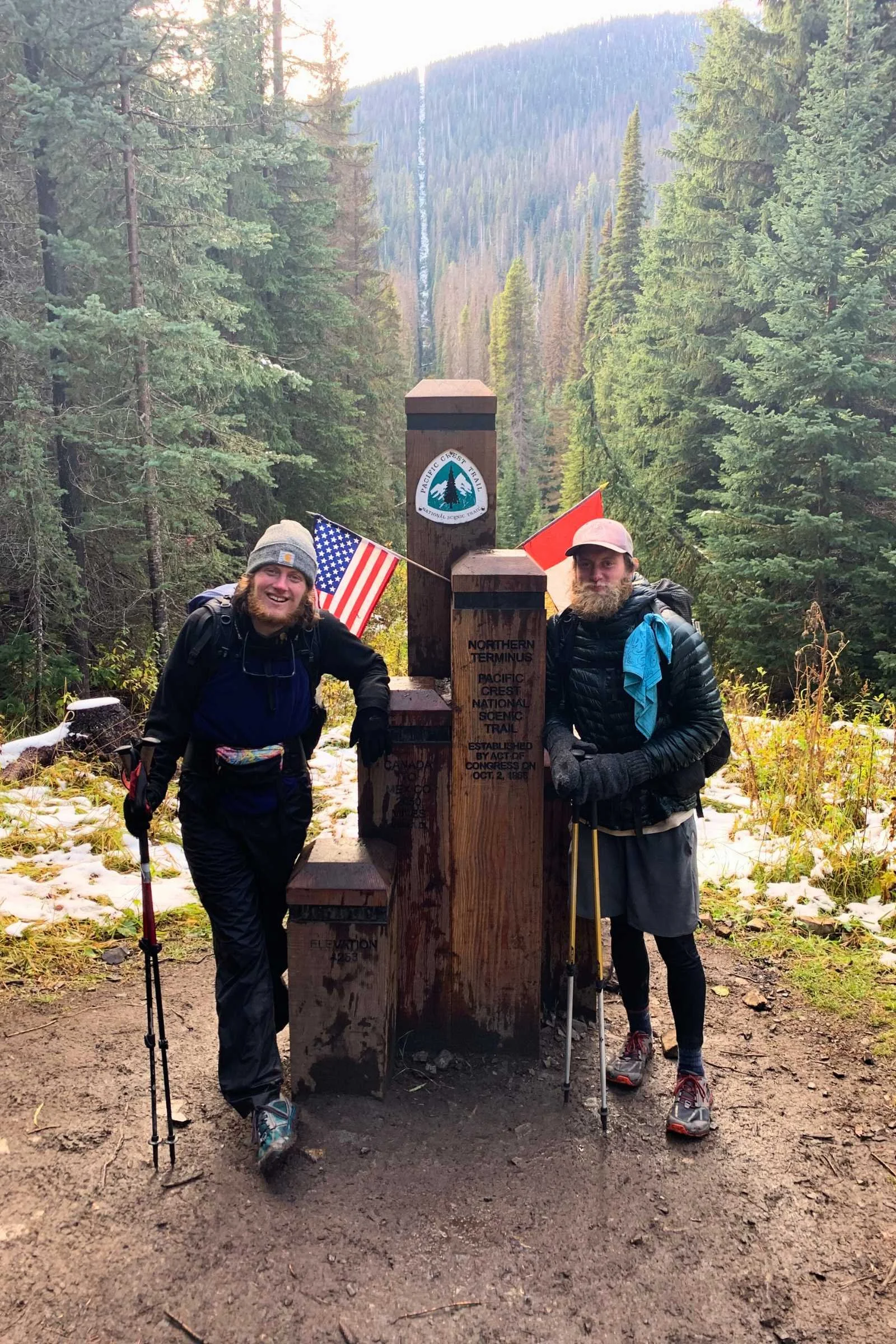 Hiker in the snow wearing REI shorts over black thermal leggings.