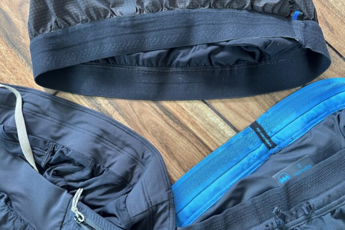 Comparison of different styles of running short waistbands including gathered and flat designs.