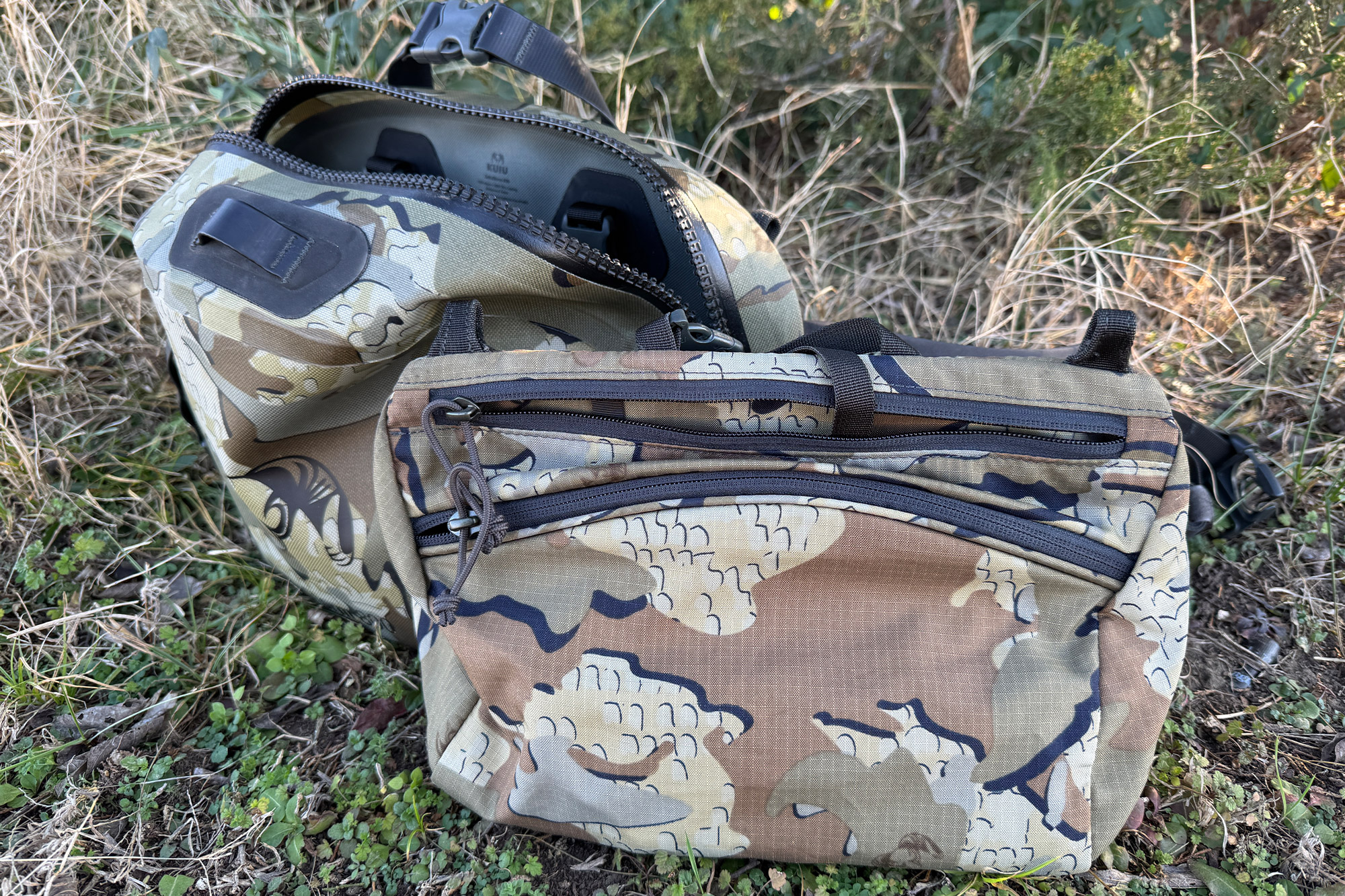 An open KUIU DeltaStorm 800 waistpack displaying the internal compartment and organization pockets.