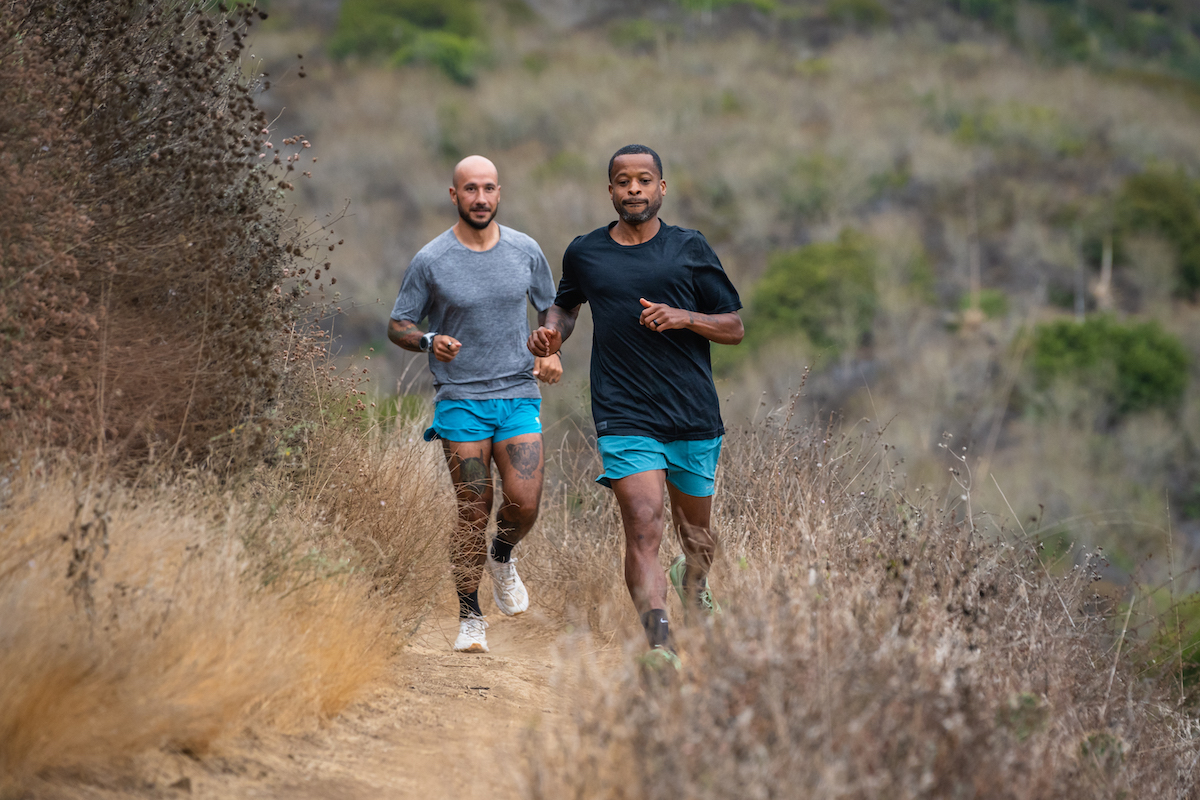 Runner wearing Rabbit Fuel n' Fly 3-inch shorts on a desert track.