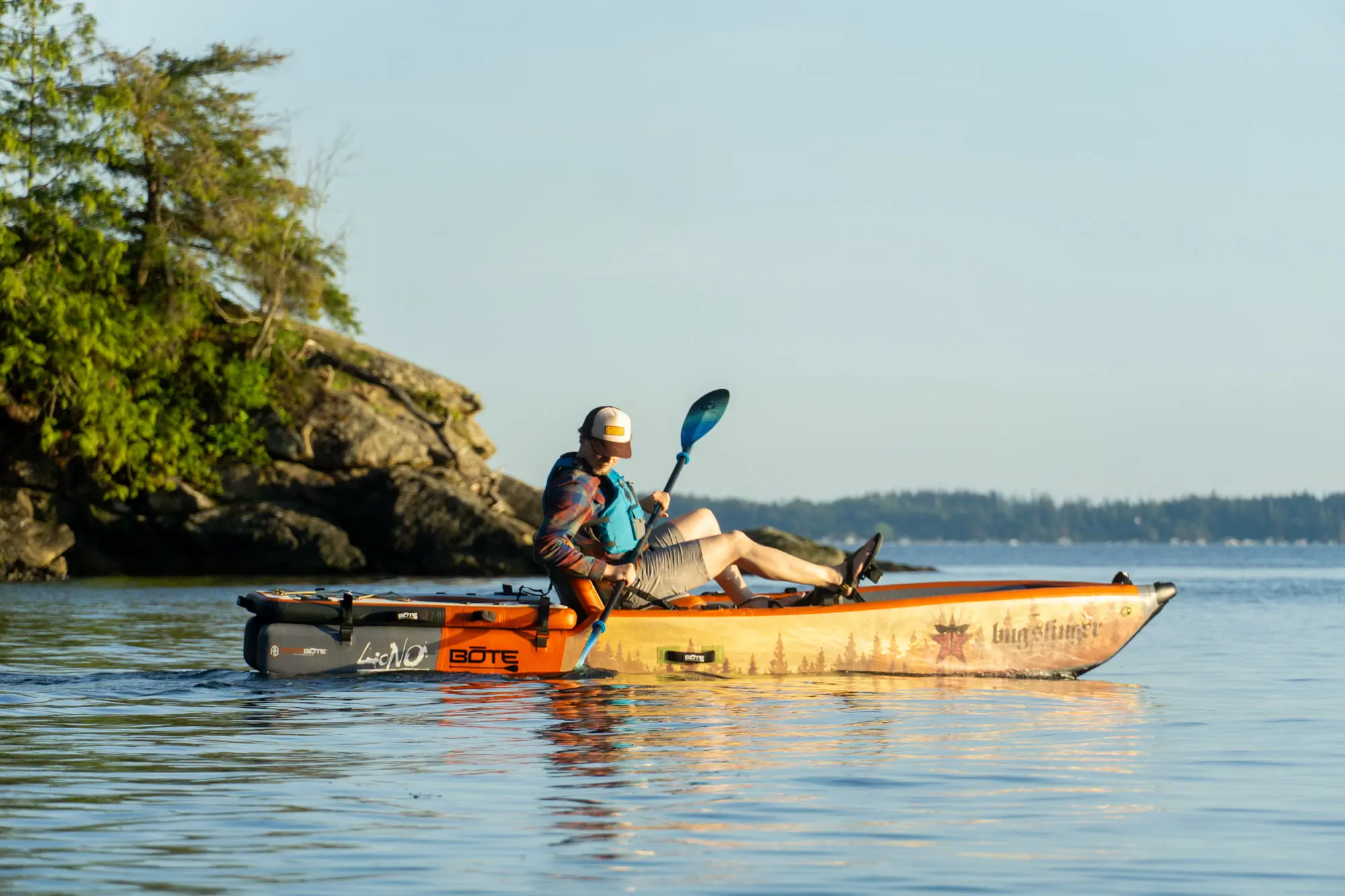 Several high-quality inflatable kayaks being tested side-by-side on the water.