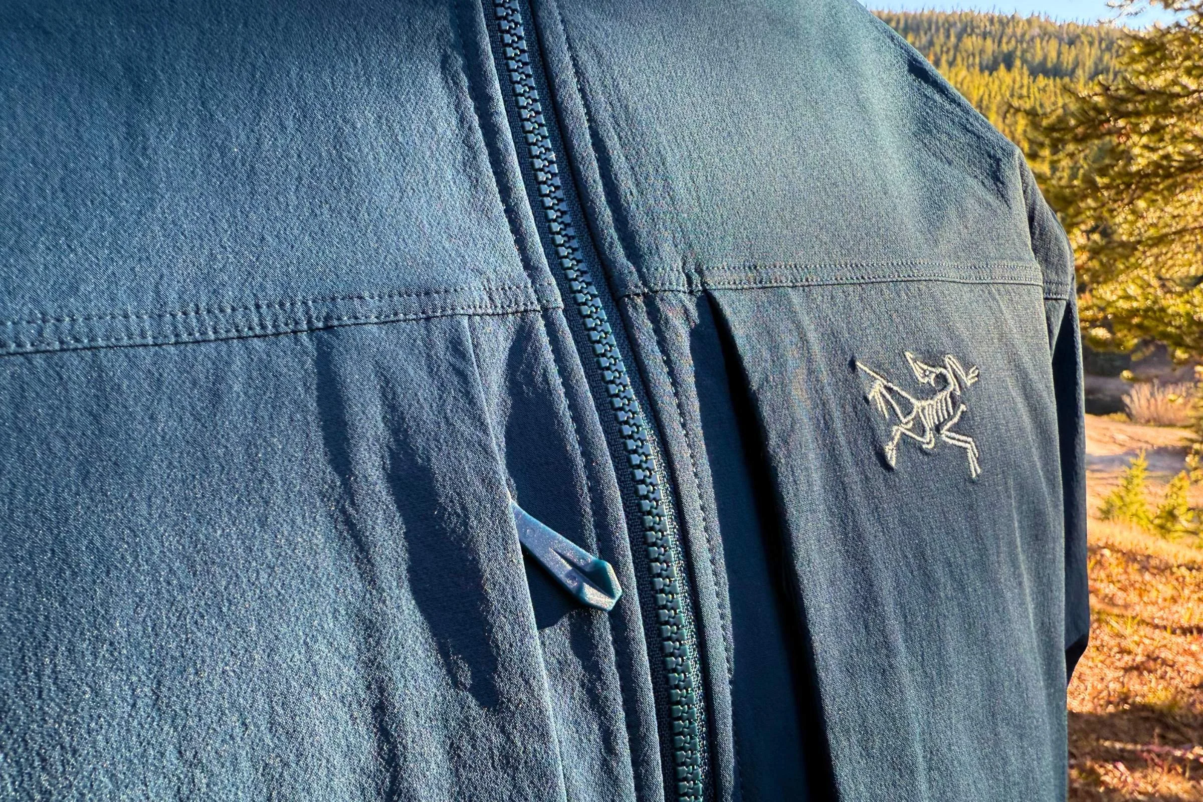 Close-up of the breathable and stretchy fabric of the Arc'teryx Gamma jacket.