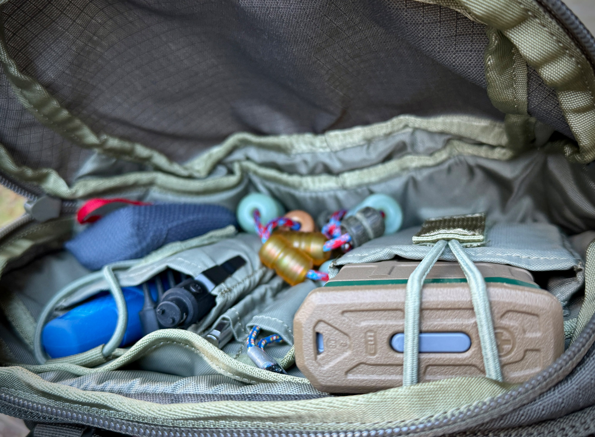 Interior view of an Eberlestock tactical pack showing various compartments and organization
