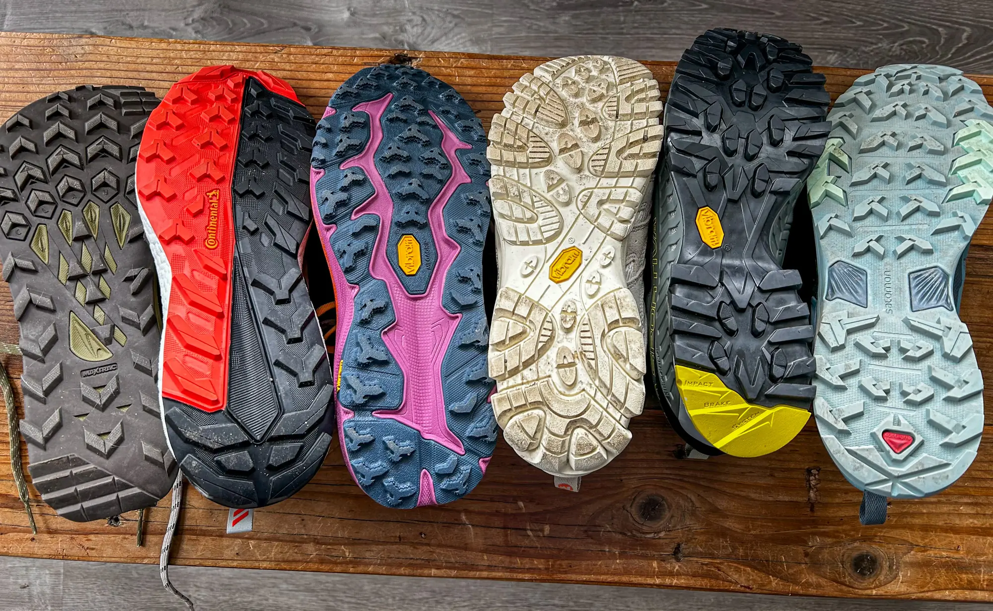 A side-by-side comparison of different hiking shoe outsole patterns.