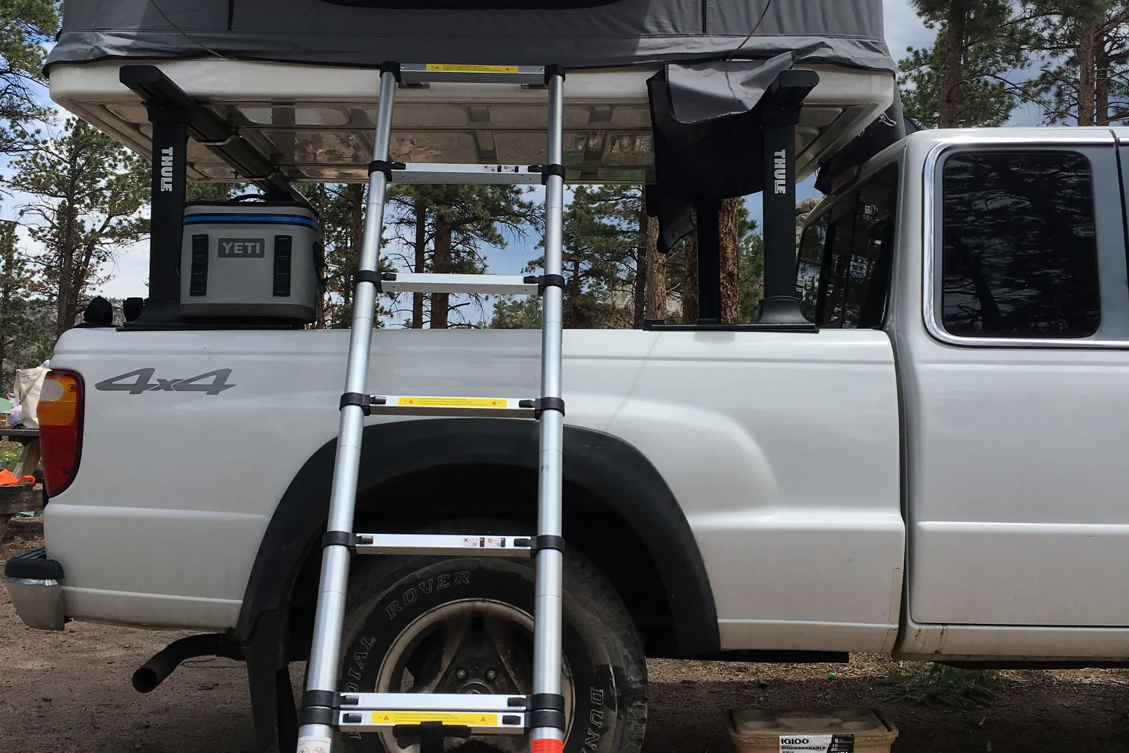 Side profile of a Roofnest Sandpiper tent with a vertical shade awning deployed.