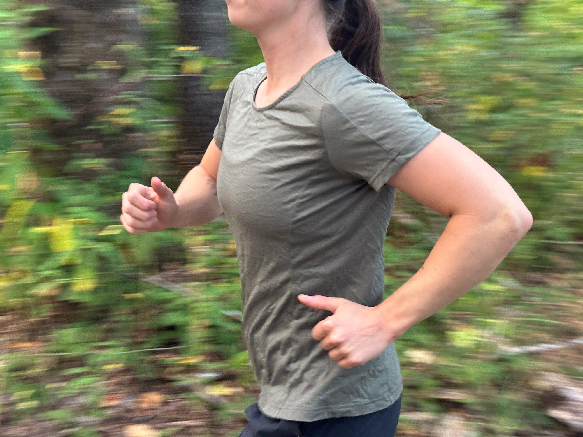 A man in a blue merino shirt performing active exercises during a performance test.