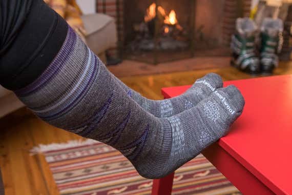 The Smartwool Ski Over the Calf socks shown worn on a tester's foot.