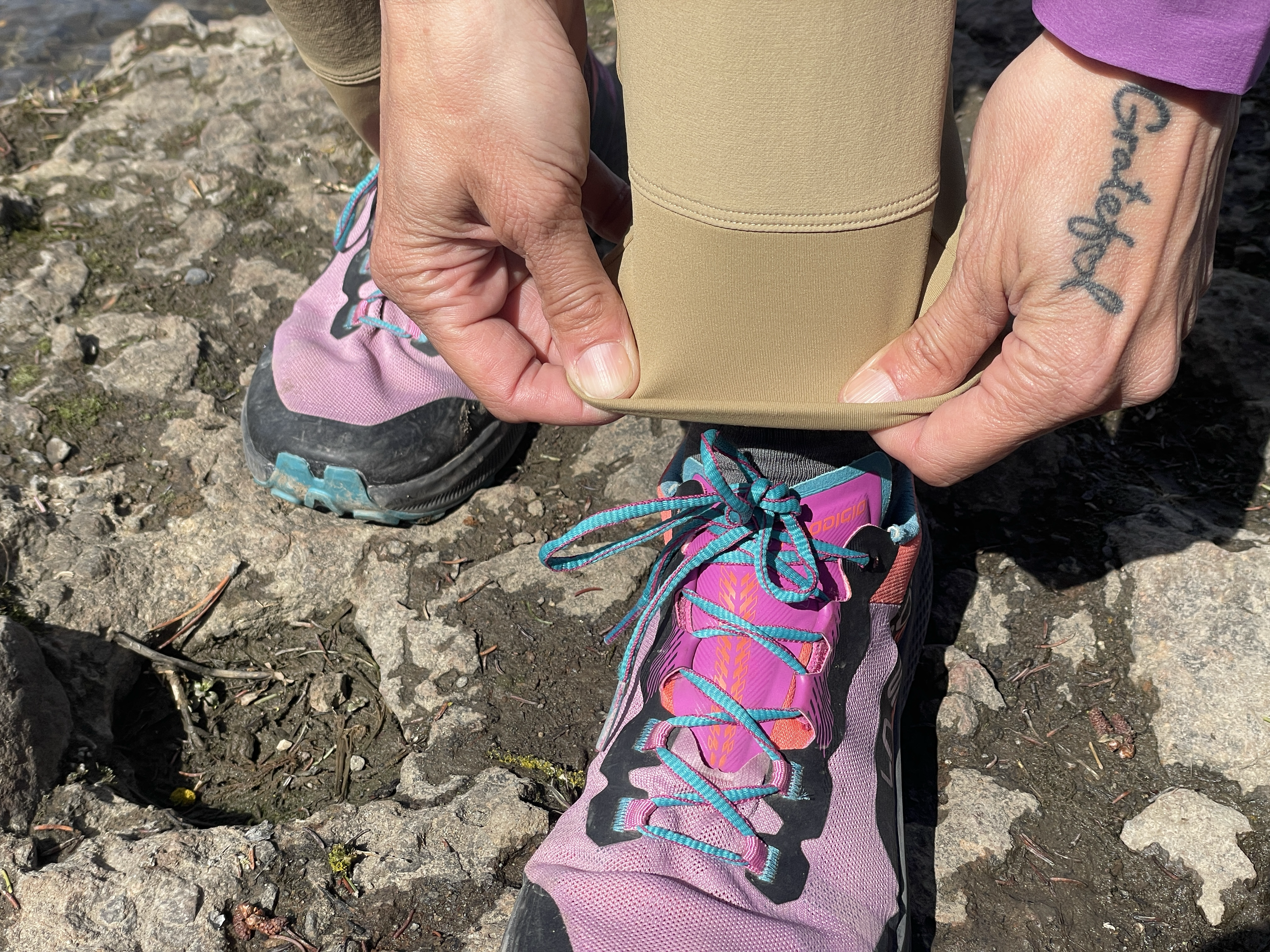 A technical view of the Arcâteryx Gamma Hybrid Pants showing the specialized waistband and fabric.