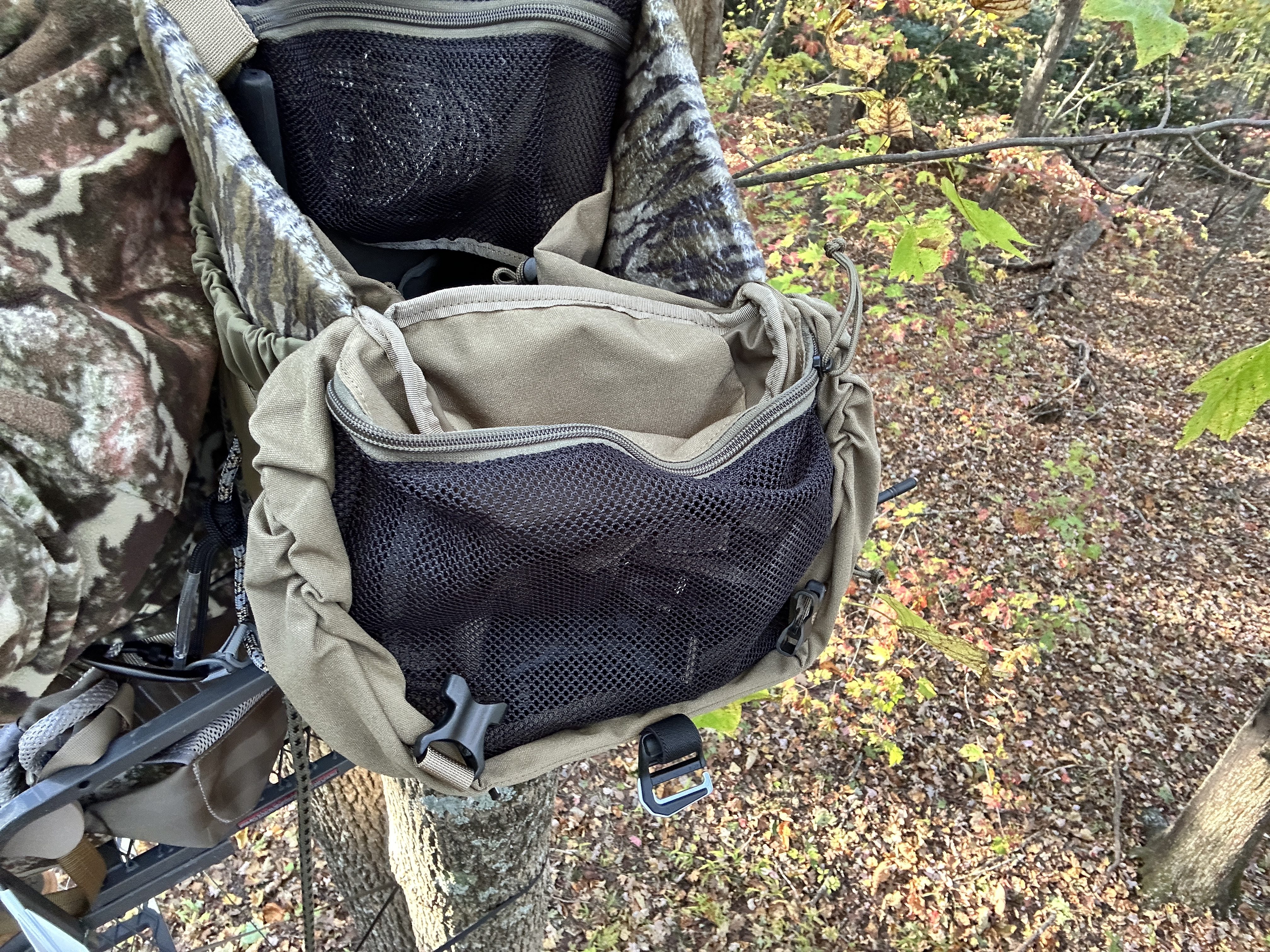 A Mystery Ranch Treehouse backpack designed for saddle hunting hanging in a tree.