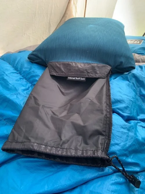 A NEMO Fillo pillow compressed tightly into its integrated storage bag.