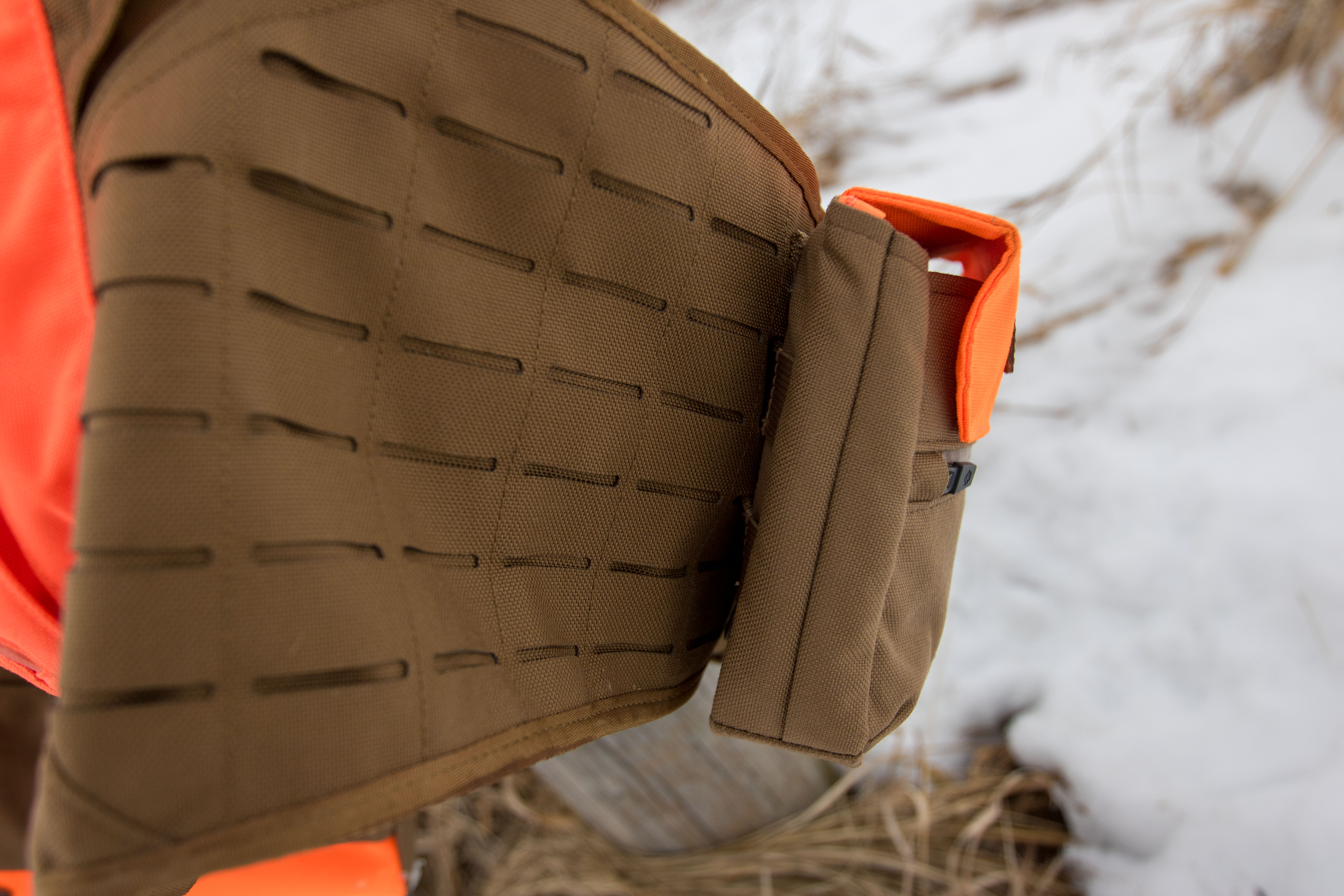 Extreme close-up of the green MOLLE webbing on the upland bird vest.