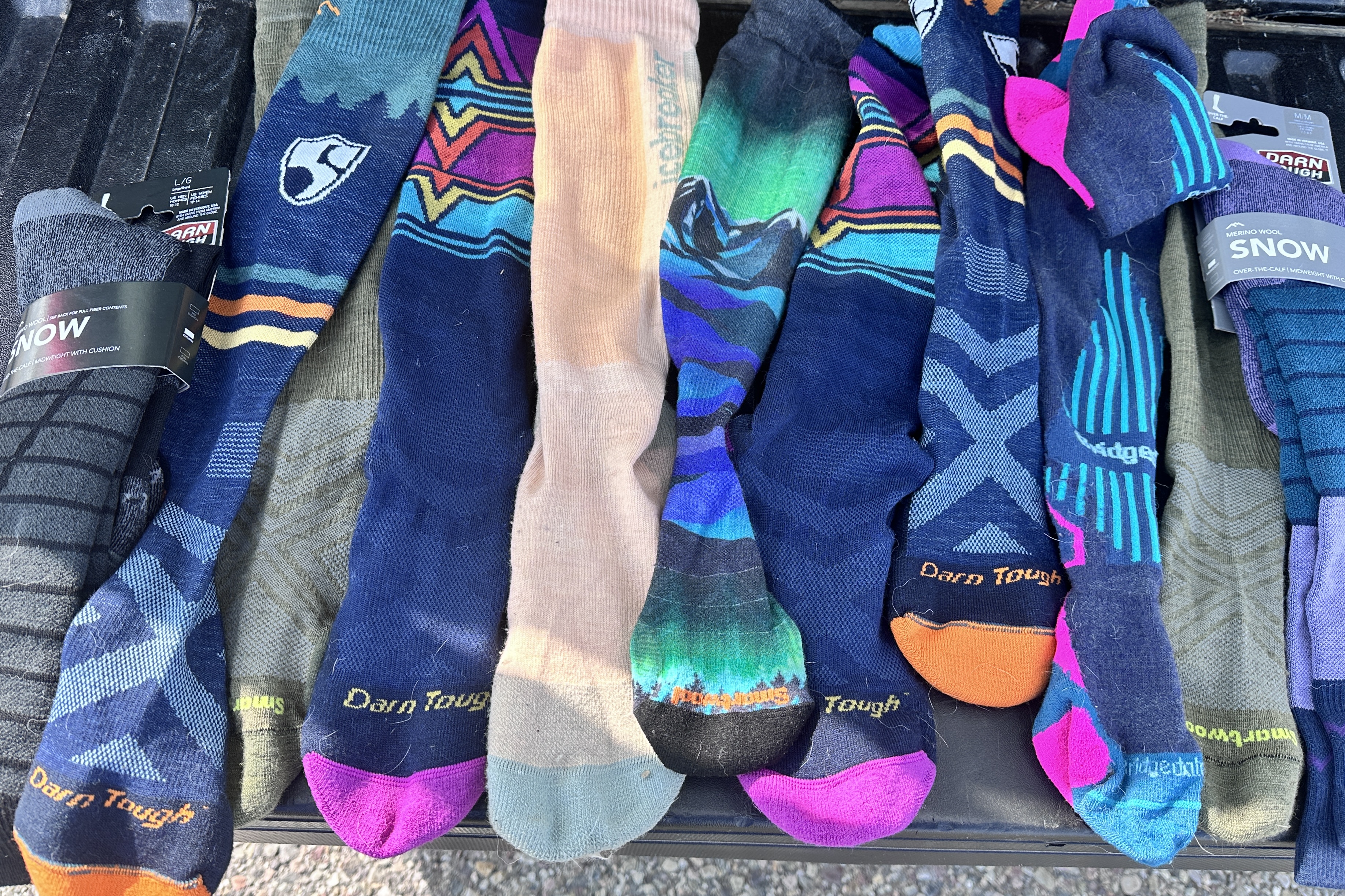 A group of various top-rated ski socks from the 2025 testing cycle.