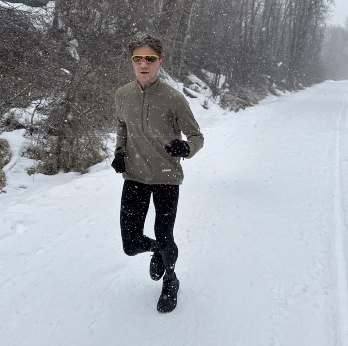 A runner wearing tight-fitting winter running leggings in cold weather.